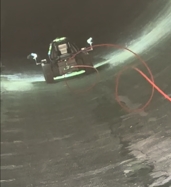 Detectra crawler inside a wind turbine blade with its lamps lit.